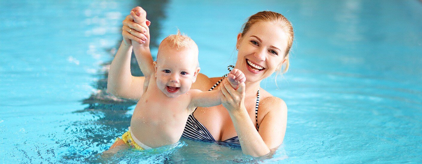 Mother and baby swimming