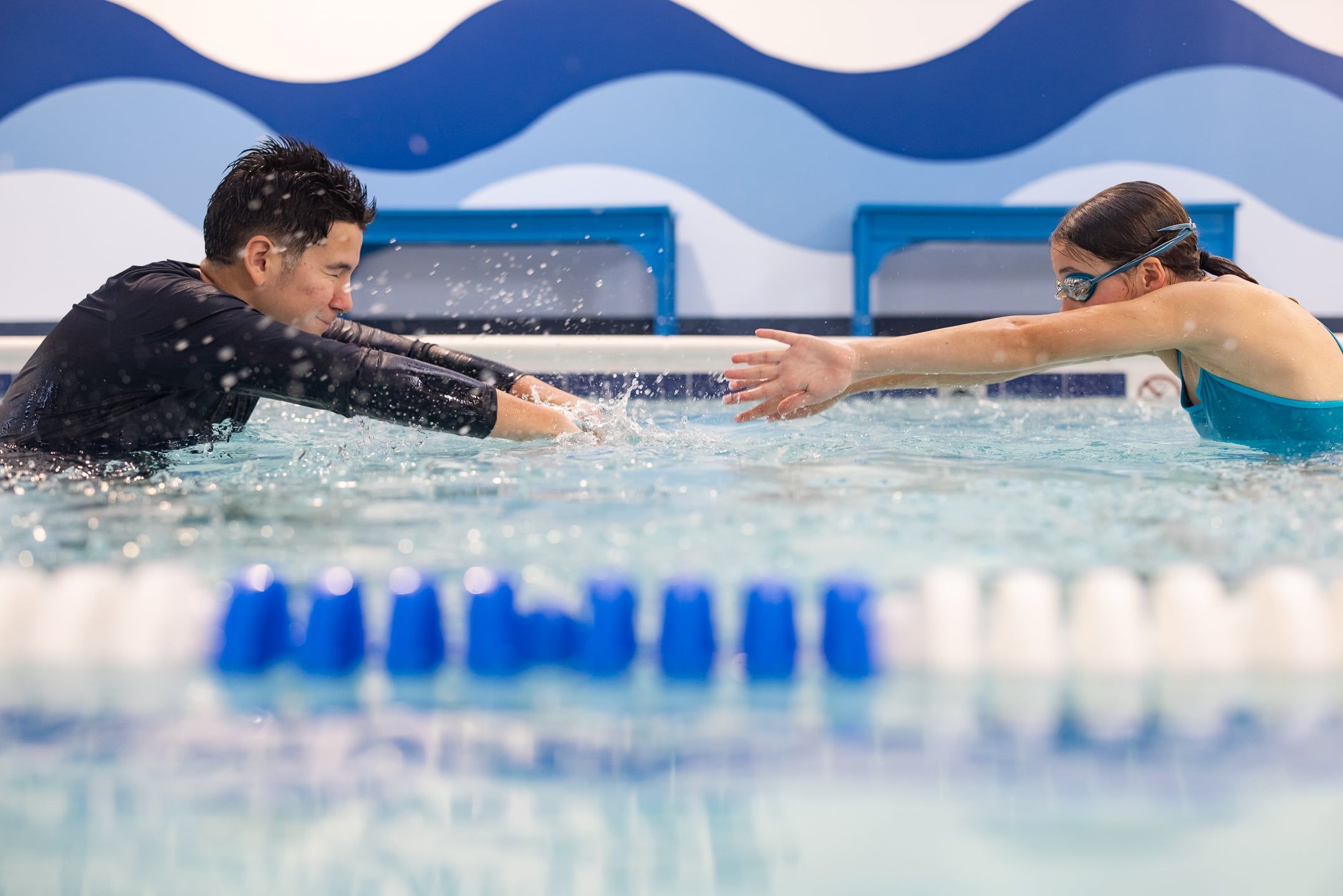 Girl doing a swim stroke in swim lesson